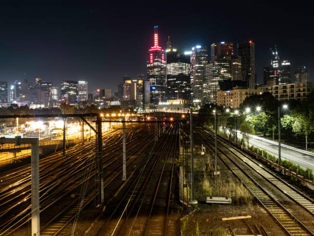 istock City skyline and train tracks at night 1452582034