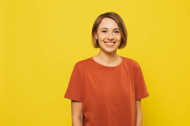 istock Blonde woman in studio on yellow background 1452587143