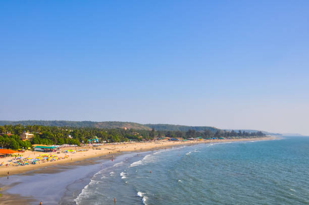 istock View on the beach with tourists in Goa 1452589172