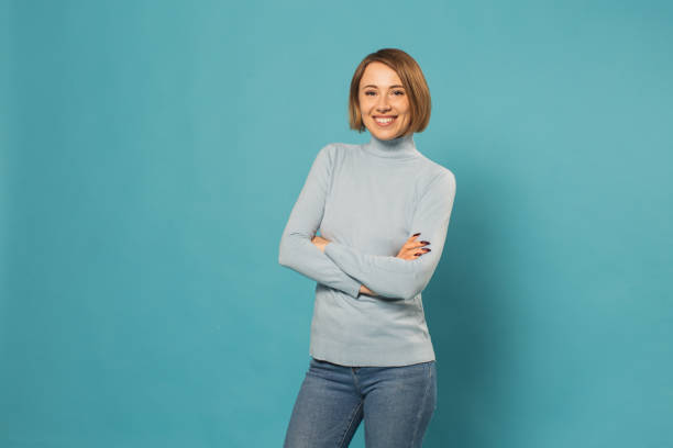 istock Blonde woman in studio on blue background 1452590133