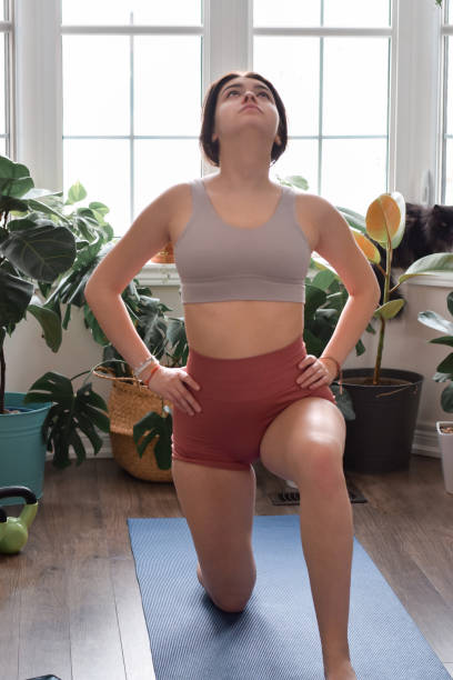 istock Young girl working out at home 1452593424