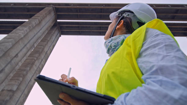 istock Female road engineer working. Building new highways. 1452602560