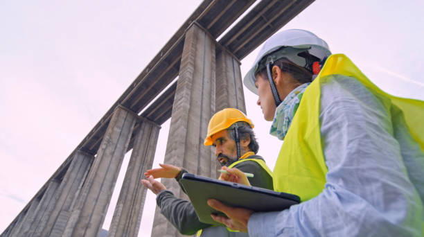 istock Road engineers working. Building new highways. 1452602565