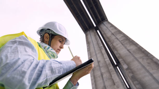 istock Female road engineer working. Building new highways. 1452602566
