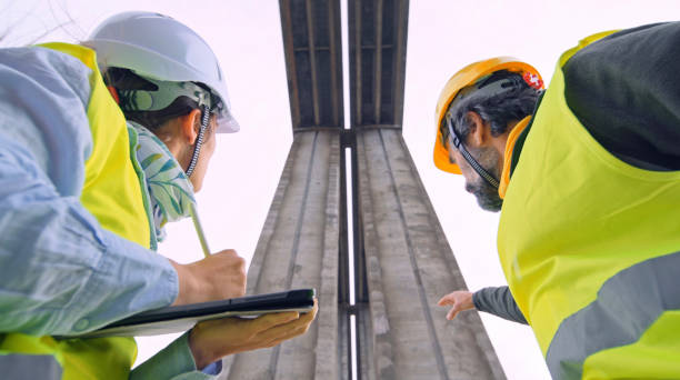 istock Road engineers working. Building new highways. 1452602568