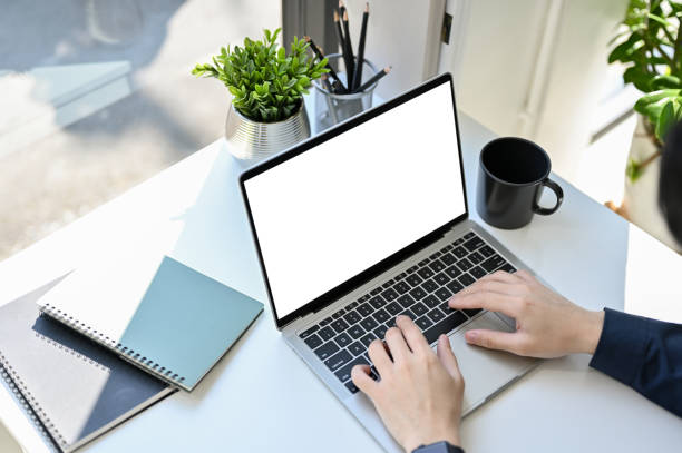 istock Top view, Professional businessman using laptop, typing on keyboard at his office desk. 1452611488