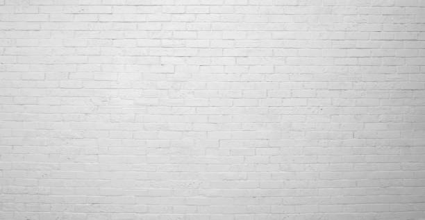 istock The painted (white) brick wall of the building. White brick wall construction background 1452611601