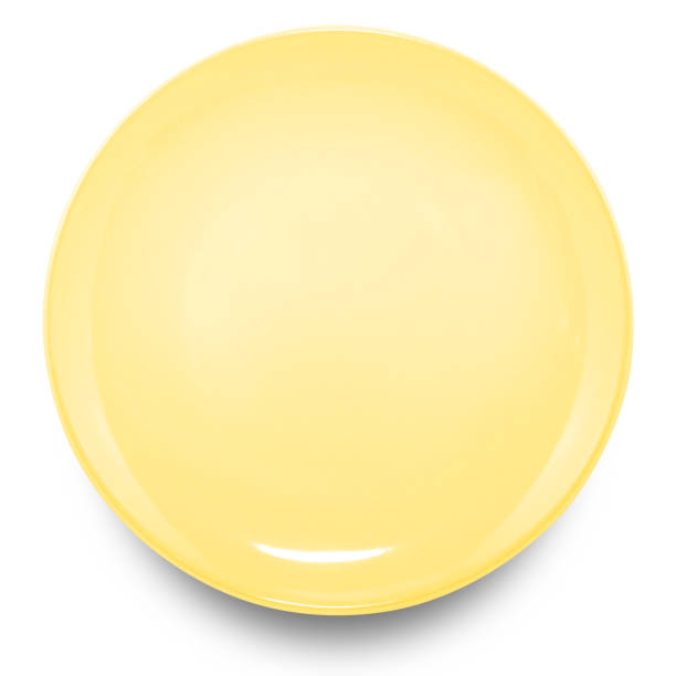 istock Yellow circle ceramics plate isolated on white background. 1452613173