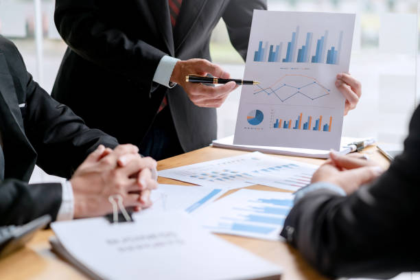 istock Team business people planning strategy brainstorming and analysis marketing and using laptop. Business meeting concept. 1452621771