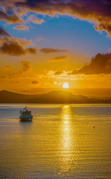 istock Aerial sunrise waterscape with boats, clouds and reflections 1452624270
