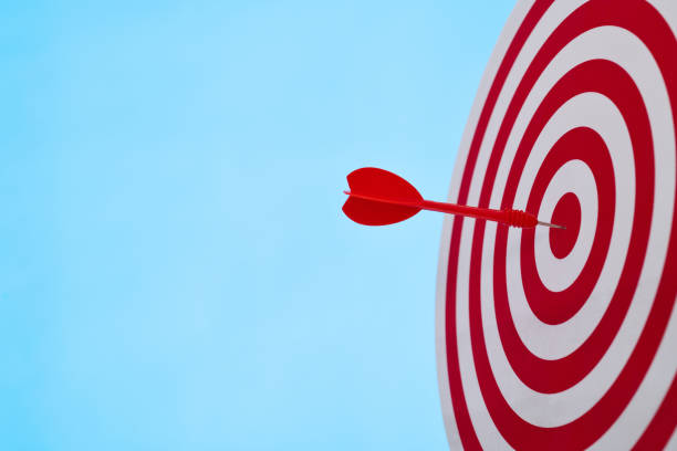 istock Dart arrow on center of dartboard 1452624976