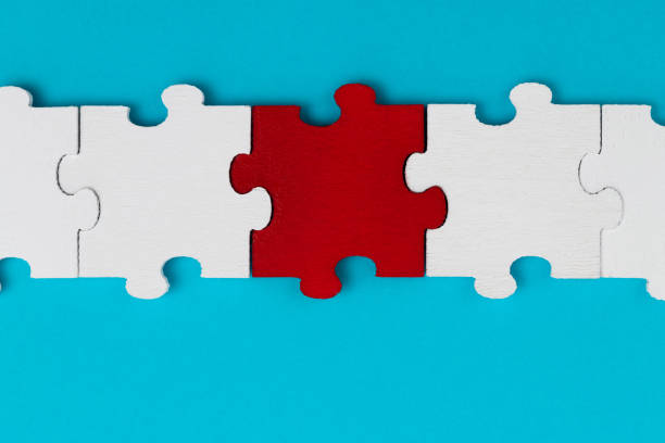 A row of jigsaw pieces on blue background.
