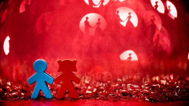 Couple figurine on shiny background.