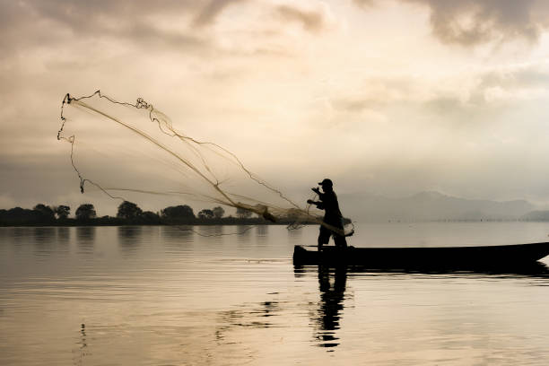 5,800+ Fisherman Casting Net Stock Photos, Pictures & Royalty-Free Images -  iStock
