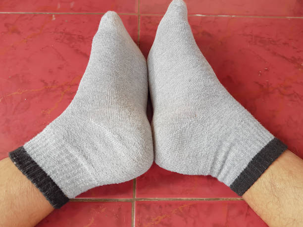 istock a pair of human legs wearing socks 1452629430