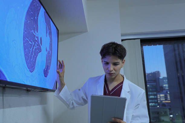 istock Young latin doctor giving a speech or presentation to colleagues 1452631617
