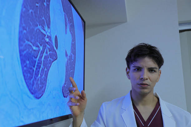 istock Young latin doctor giving a speech or presentation to colleagues 1452632157