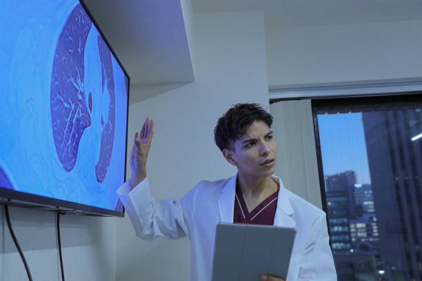 istock Young latin doctor giving a speech or presentation to colleagues 1452632179