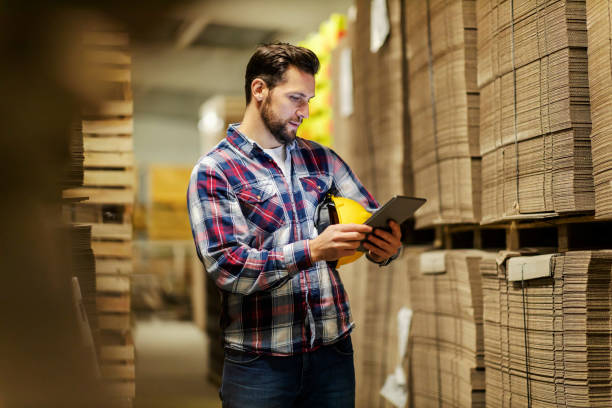 istock A warehouse supervisor looking at the tablet and checking on inventory. 1452632374