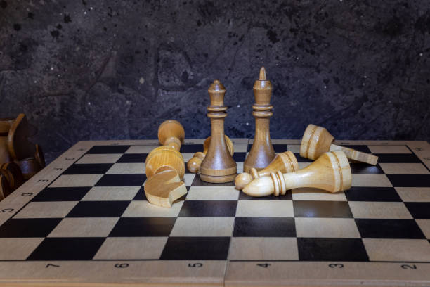 istock Black and white chess pieces on a chessboard 1452633289