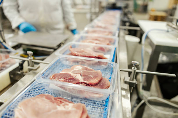 istock Close up of a meat packing machine. 1452634429