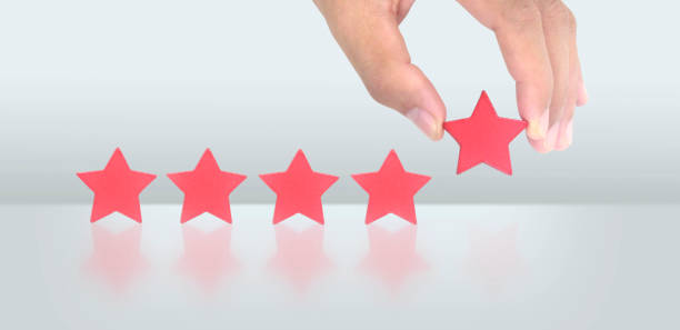istock Rise on increasing five stars in human hand, Increase rating 1452638241