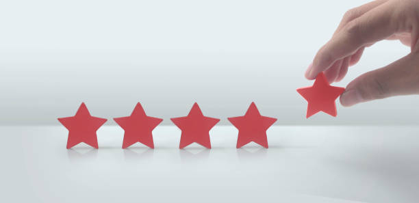 istock Rise on increasing five stars in human hand, Increase rating 1452638250