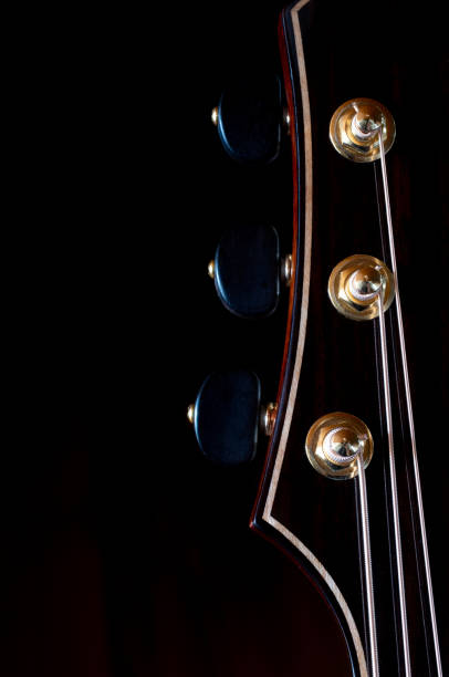 istock guitar headstock made isolated on Black Background 1452646342
