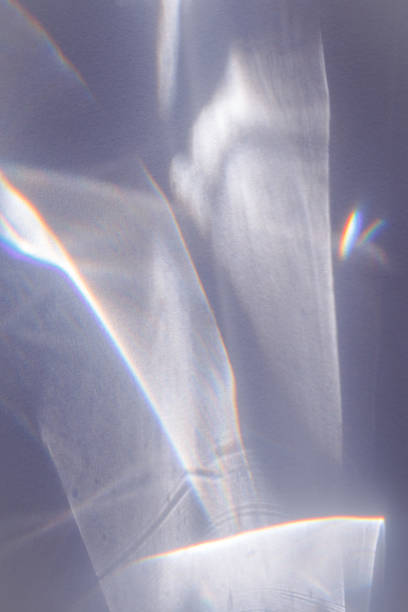 istock Sunlight background, abstract photo with light and shadow, glare and shine on paper texture, rainbow flare from sun, gray blue minimal aesthetic fon. Natural light and caustic effects. 1452650121