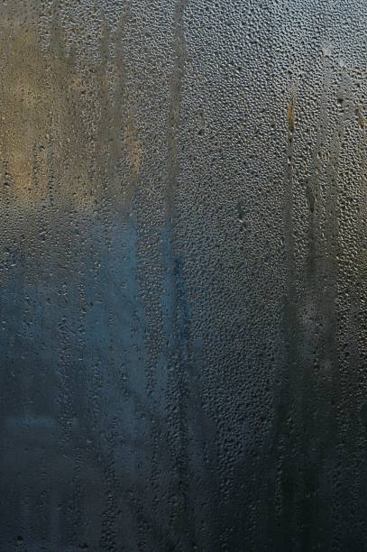 istock glass with drops of water or dew. vertical 1452650775