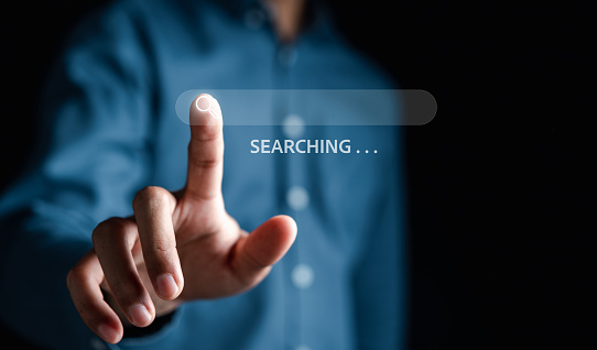 Businessman touching virtual screen searching data for search engine Optimization or SEO, Internet connection online for find information, Using Search Console with website.
