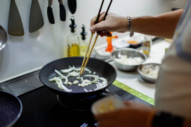 Focus on cooking private dishes close-up on the stove