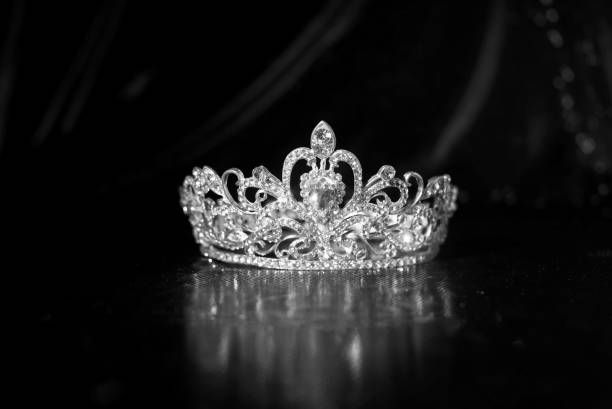 istock Royal crown on luxury satin, silk fabric background. Black and white 1452651766