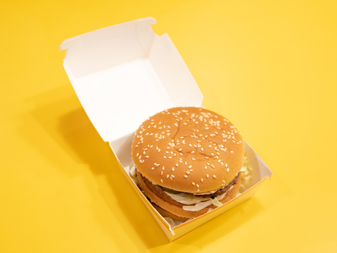 Big Mac Hamburger Close-up on Yellow Background