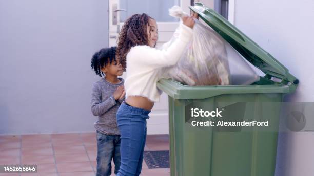 Dirt Bag Housework And Children Taking Trash To Throw In Bin After Cleaning Chores And Housekeeping Child Development Housekeeping And Young Kids With Garbage Food Waste And Rubbish In Backyard Stock Photo - Download Image Now