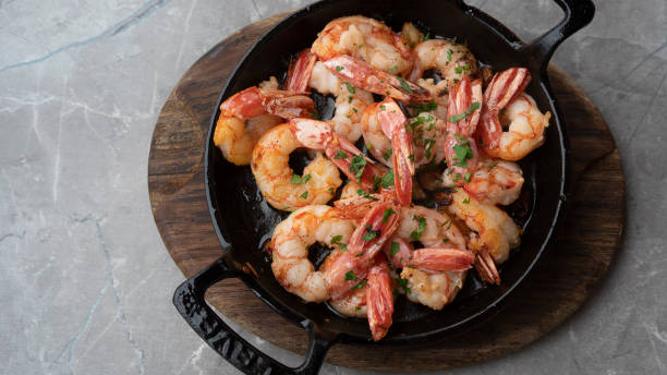 istock Fried appetizing shrimp in a cast iron skillet 1452657322