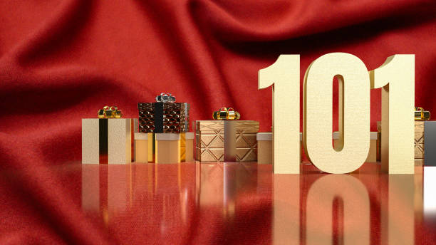 istock gold number 101 and gift box on red silk for business concept 1452657363