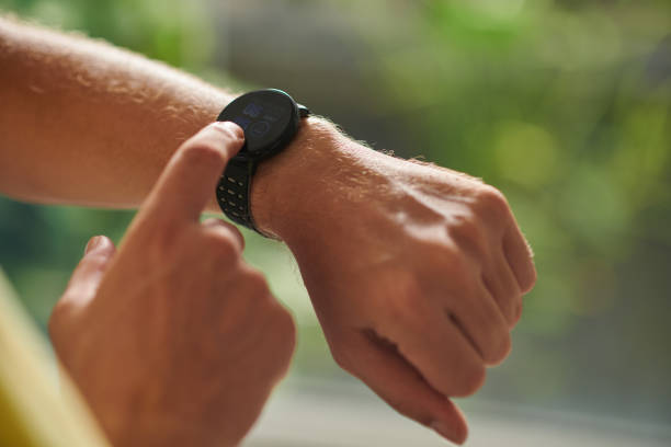 istock Sportsman Checking Fitness Tracker 1452658564