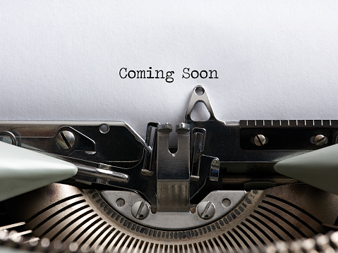 The announcement message coming soon written with a vintage typewriter.