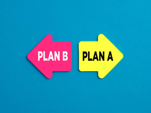 istock Choosing business Plan A or Plan B alternative options. The words plan a and plan b on arrows pointing on opposite directions. 1452666392