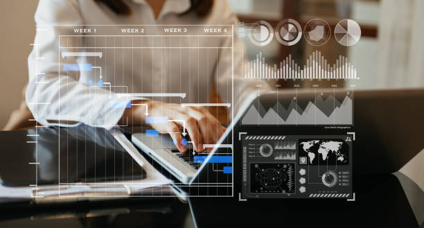 istock Businessman hand Project manager working and update tasks and Gantt chart scheduling virtual diagram.with smart phone, tablet and laptop in office. 1452666626