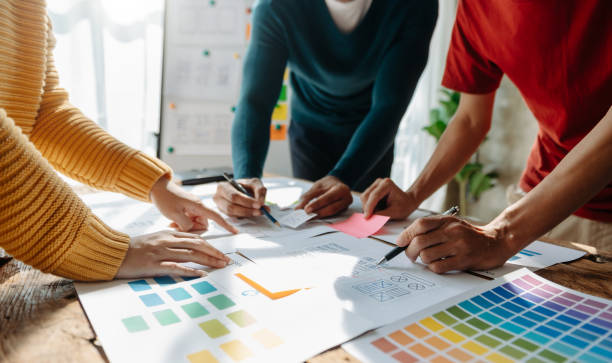 istock View of UI developer team brainstorming on their project with laptop, smartphone and digital tablet. Creative digital development agency. 1452666666
