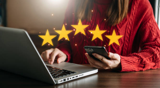 istock Customer or client the stars to complete five stars. with copy space. giving a five star rating. Service rating, satisfaction concept. 1452666679