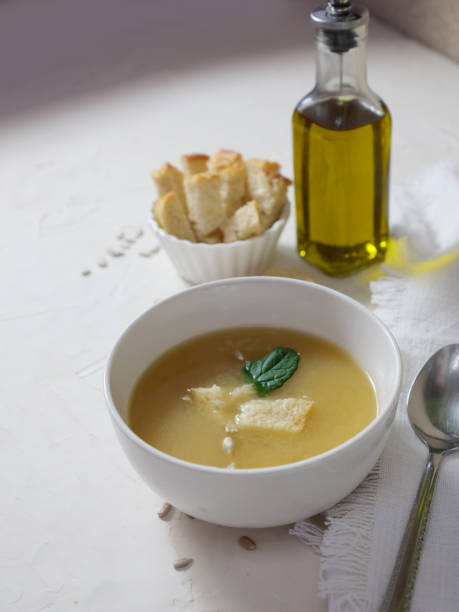 istock cream soup with olive oil and bread 1452666916
