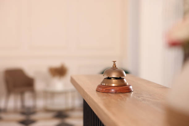 istock Hotel service bell on wooden reception desk. Space for text 1452667037