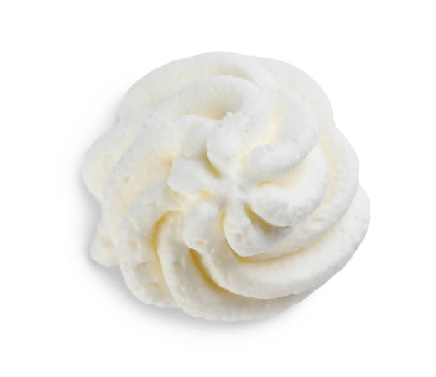 istock Delicious whipped cream isolated on white, top view 1452667098