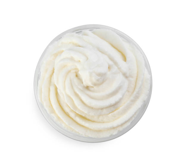istock Delicious whipped cream isolated on white, top view 1452667147