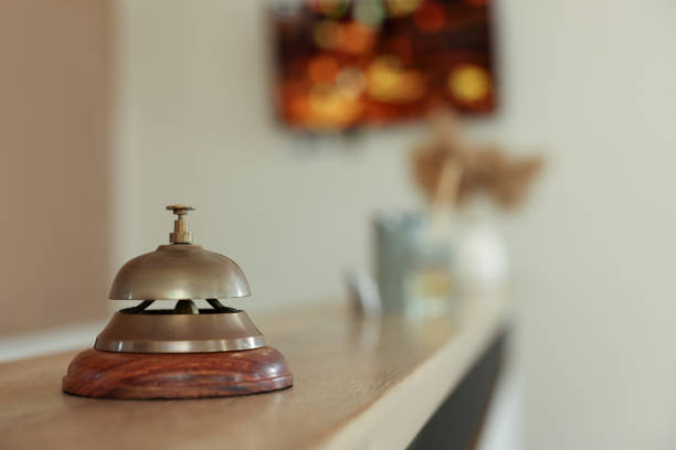 istock Hotel service bell on wooden reception desk. Space for text 1452667154