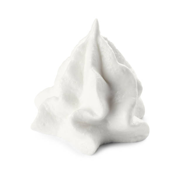 istock Delicious fresh whipped cream isolated on white 1452667251