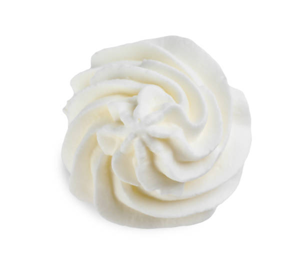 istock Delicious whipped cream isolated on white, top view 1452667252